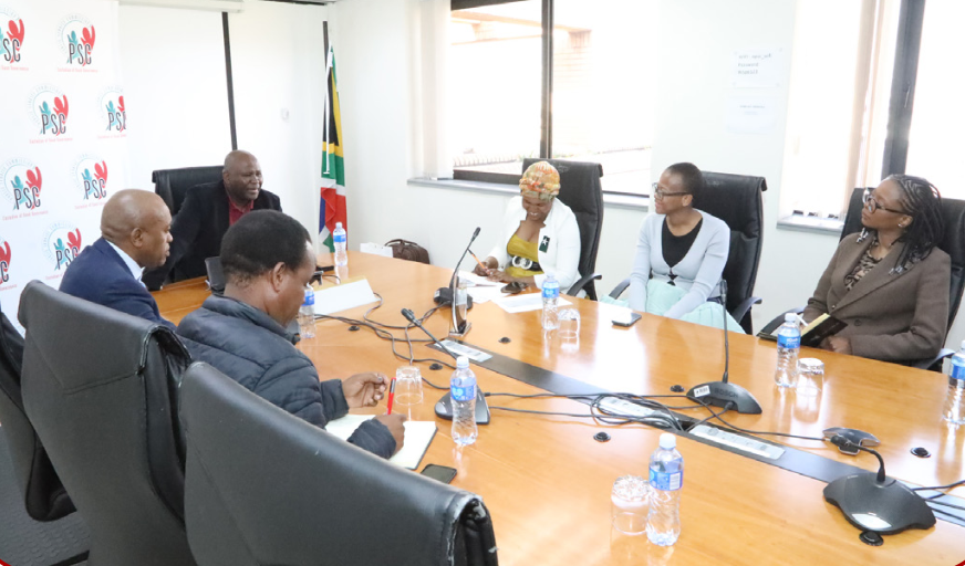 PSC meeting with royal family representatives in a boardroom